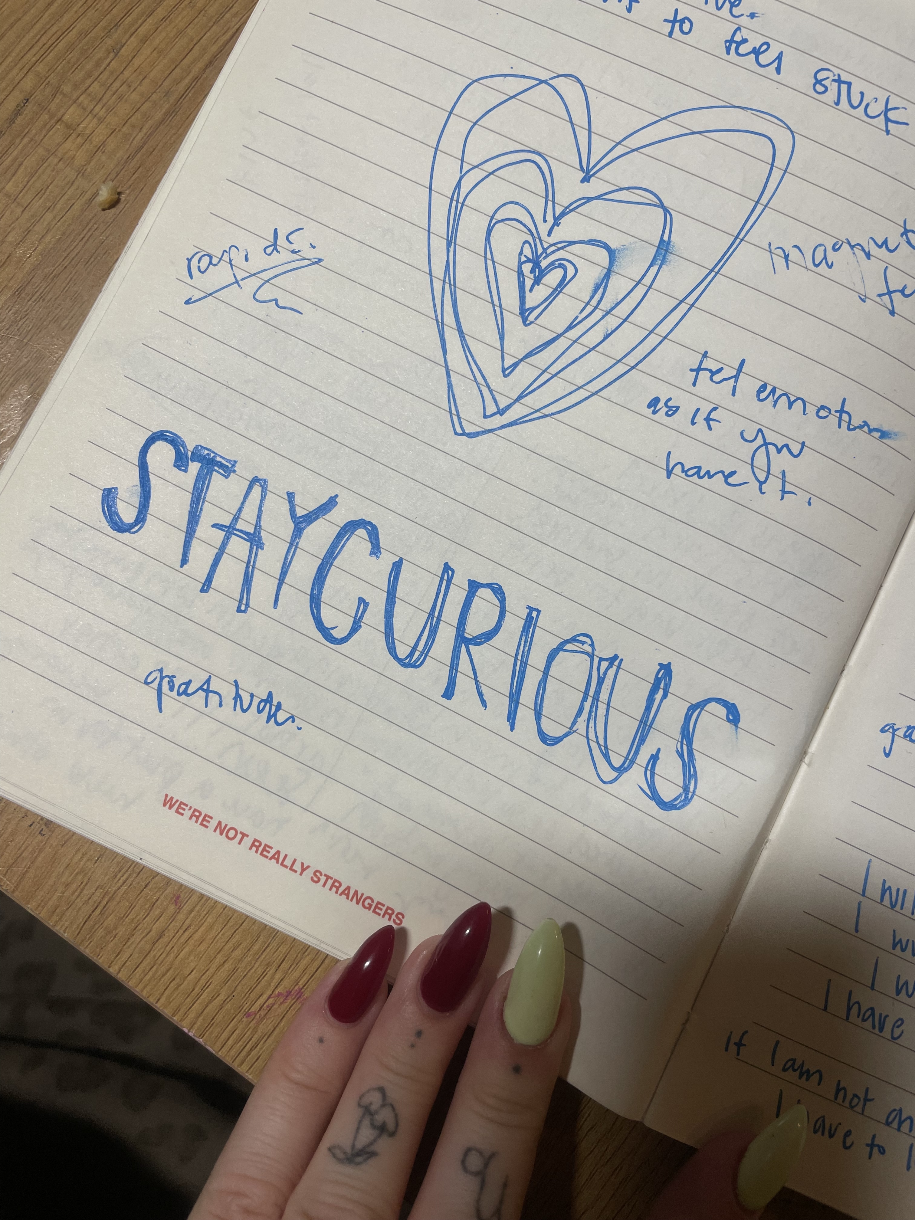 perri's hand holding an iced coffee that reads the p money honey